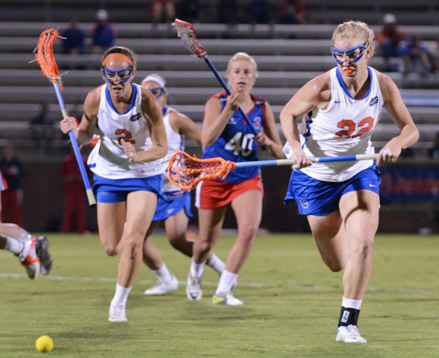 Senior Brittany Dashiell (22) runs after the ball during Florida’s 18-13 exhibition win against England on Jan. 24 at Dizney Stadium. Dashiell became the first Gator to record 200 career draw controls on Saturday.