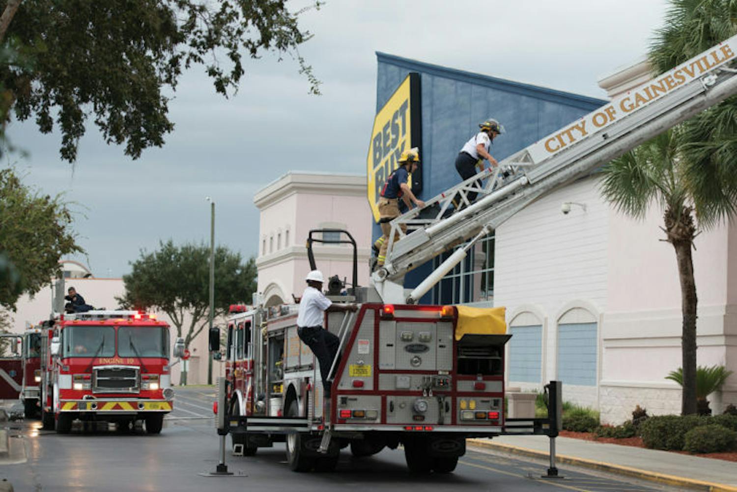 Gainesville Fire Rescue works to put out a fire on about 60 of the solar panels of a Butler Plaza Best Buy storage unit. The cause of the fire is under investigation.