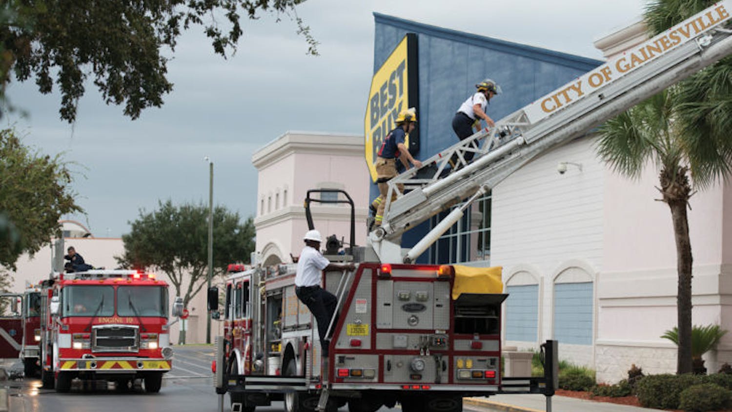 Gainesville Fire Rescue works to put out a fire on about 60 of the solar panels of a Butler Plaza Best Buy storage unit. The cause of the fire is under investigation.