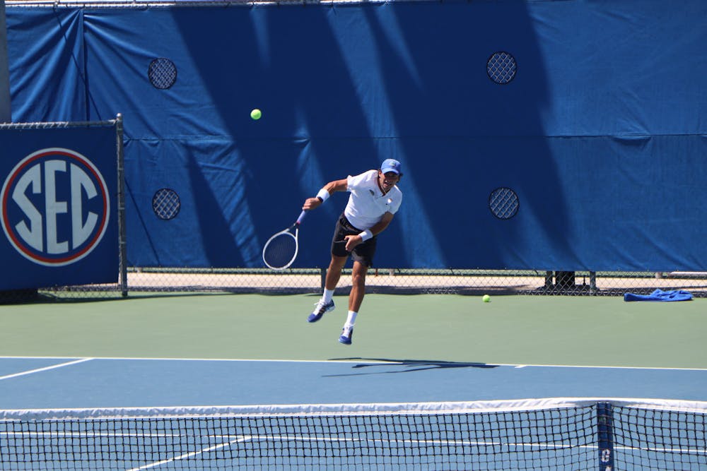 <p>Florida&#x27;s Duarte Vale hammers a ball against South Florida on May 9, 2021. Vale dropped a critical singles match during the Gators&#x27; loss to Texas Friday. </p>