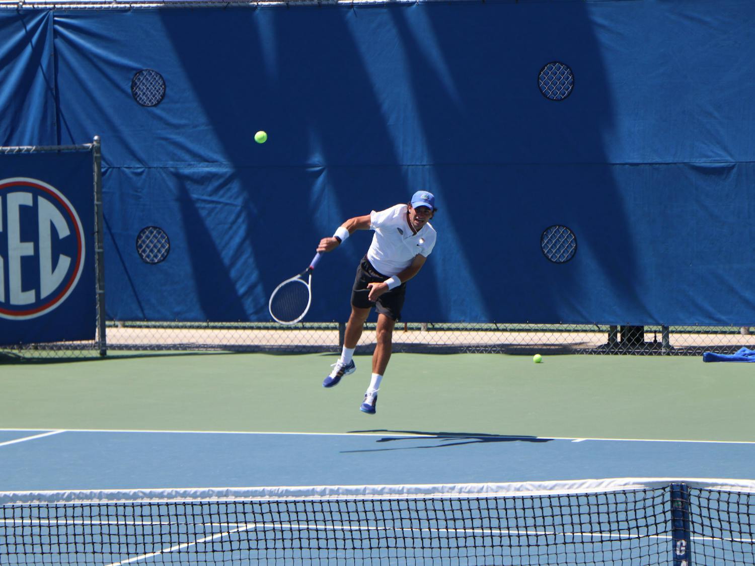 Florida&#x27;s Duarte Vale hammers a ball against South Florida on May 9, 2021. Vale dropped a critical singles match during the Gators&#x27; loss to Texas Friday. 