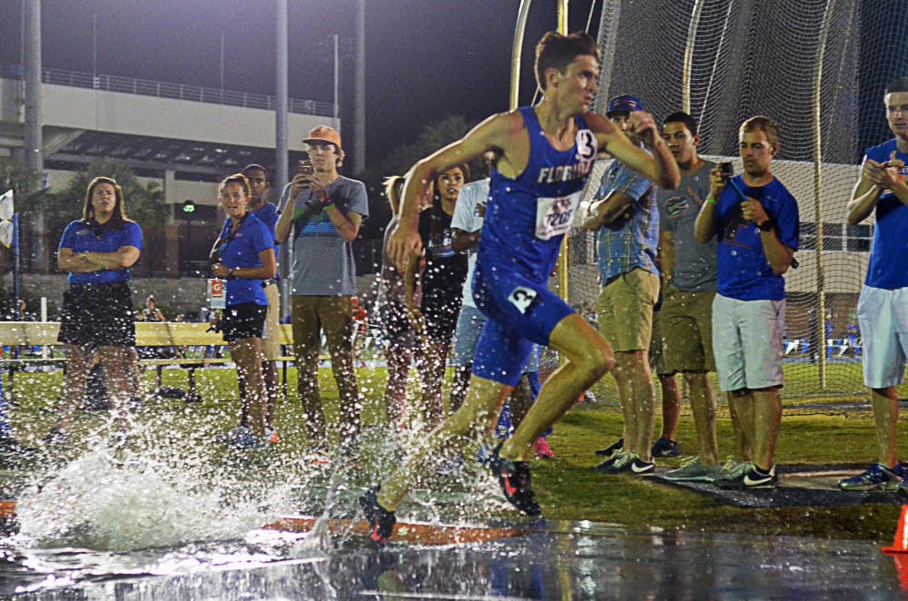 <p>Mark Parrish races in the 3,000 meter steeplechase during the 2015 Florida Relays on April 3 at the Percy Beard Track.</p>