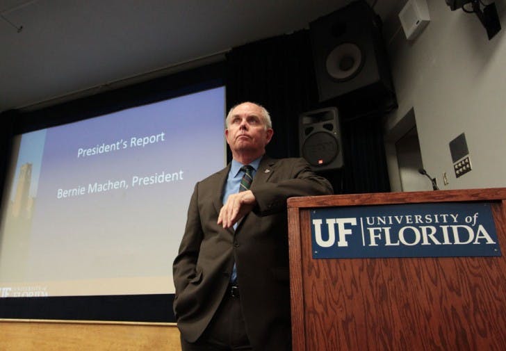 UF President Bernie Machen listens to faculty members' concerns about the GatorCare self-insurance plan at the Faculty Senate meeting Thursday. Machen also discussed possible tuition increases.