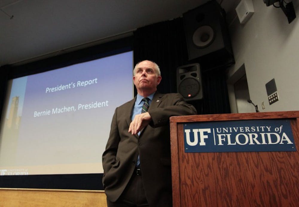<p>UF President Bernie Machen listens to faculty members' concerns about the GatorCare self-insurance plan at the Faculty Senate meeting Thursday. Machen also discussed possible tuition increases.</p>