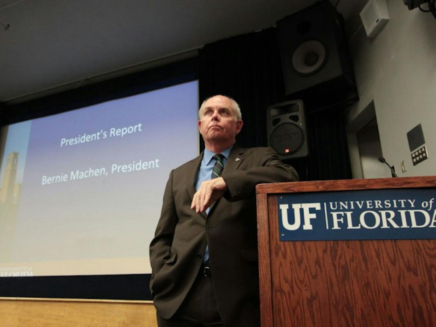 UF President Bernie Machen listens to faculty members' concerns about the GatorCare self-insurance plan at the Faculty Senate meeting Thursday. Machen also discussed possible tuition increases.