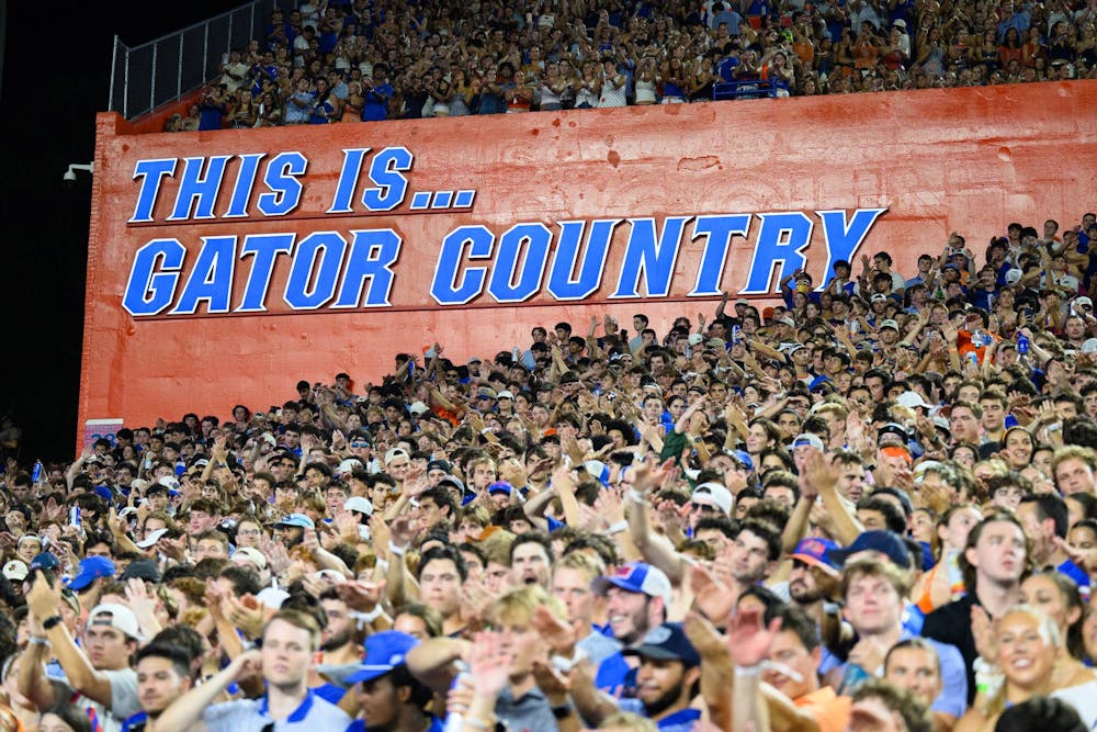 Fans chomp during the first half of an NCAA college football game against FAU, Saturday, Sept. 5, 2026, in Gainesville, Fla.