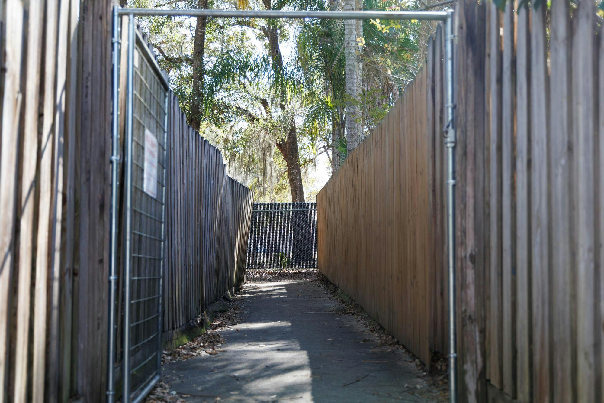 The walkway to the fence that surrounds the field of Glen Springs Elementary School in Gainesville, Fla., Friday, Jan. 23, 2026.