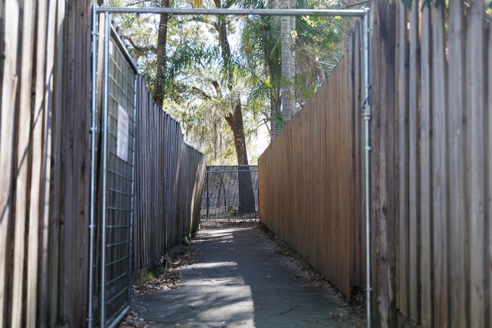The walkway to the fence that surrounds the field of Glen Springs Elementary School in Gainesville, Fla., Friday, Jan. 23, 2026.