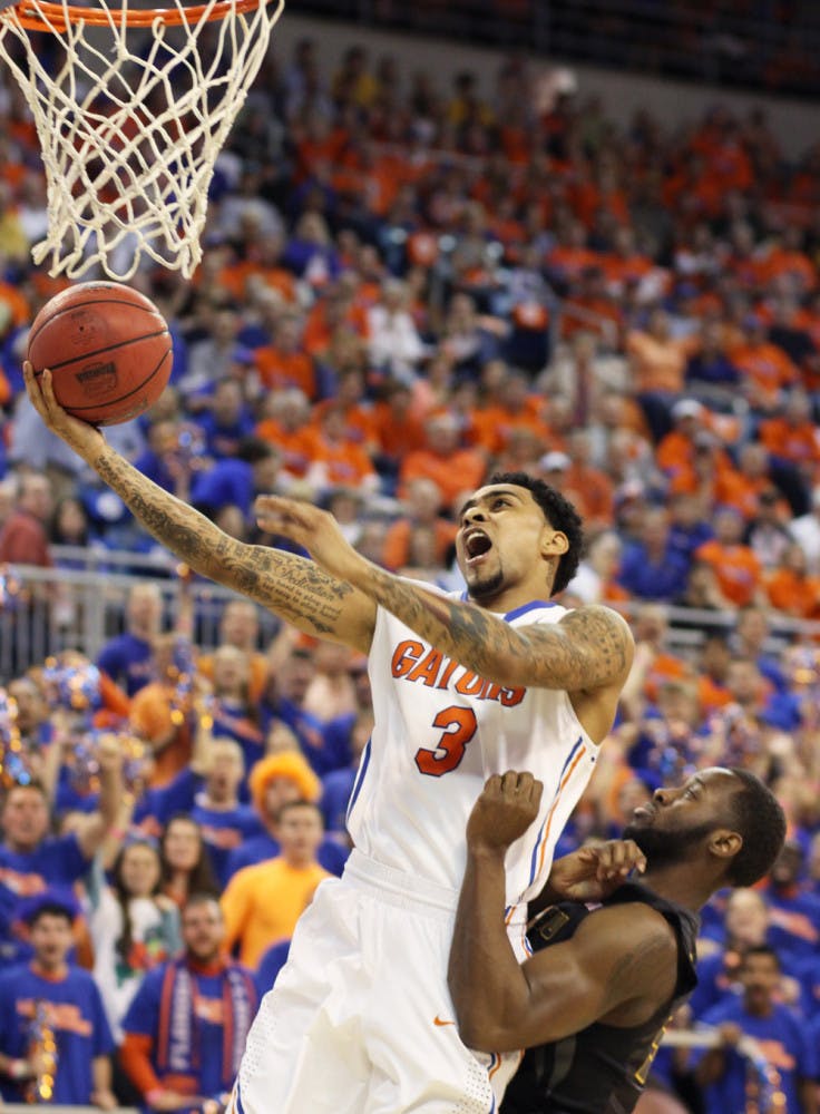 Mike Rosario (3) attempts a shot during Florida’s 83-52 win against Missouri on Saturday in the O’Connell Center.
