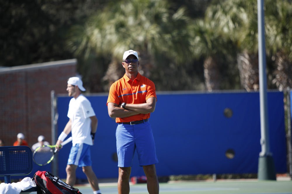 <p>UF men's tennis coach Bryan Shelton looks on during Florida's 4-2 win against UCLA on Feb. 5, 2017, at the Ring Tennis Complex.</p>