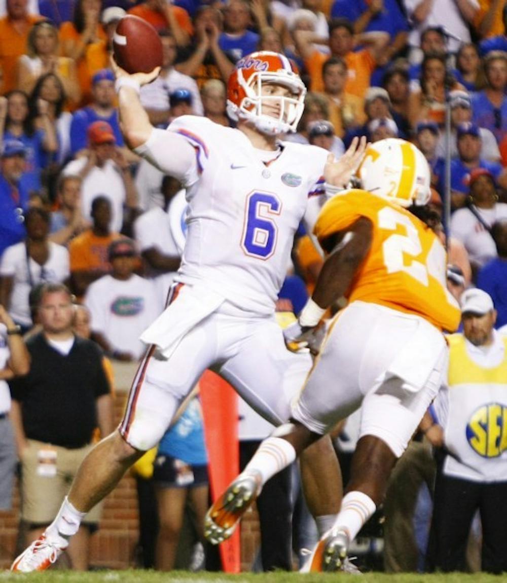 <p>Florida quarterback Jeff Driskel (6) attempts a pass over the Tenneesee defense during a 37-20 victory against Tennessee on Saturday at Neyland Stadium.</p>