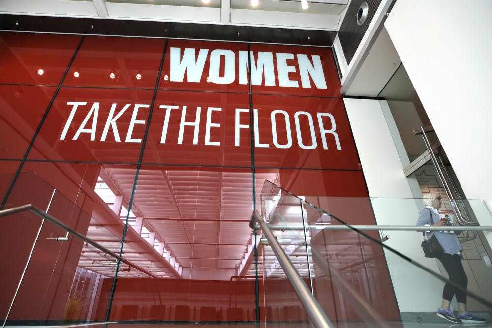 <p>In this Sept. 18, 2019, photo, a woman enters an exhibit at the Museum of Fine Arts in Boston. In the wake of a student group incident last spring when the world-class museum was accused of racism, the MFA has scrambled to make amends. It has created a new position, senior director of inclusion, in an effort to become a more deliberately diverse organization. In a nod to the need for greater gender equity, it has given over an entire wing to female artists in "Women Take the Floor," an exhibition timed to coincide with next year's centennial of U.S. women winning the right to vote. (AP Photo/Elise Amendola)</p>