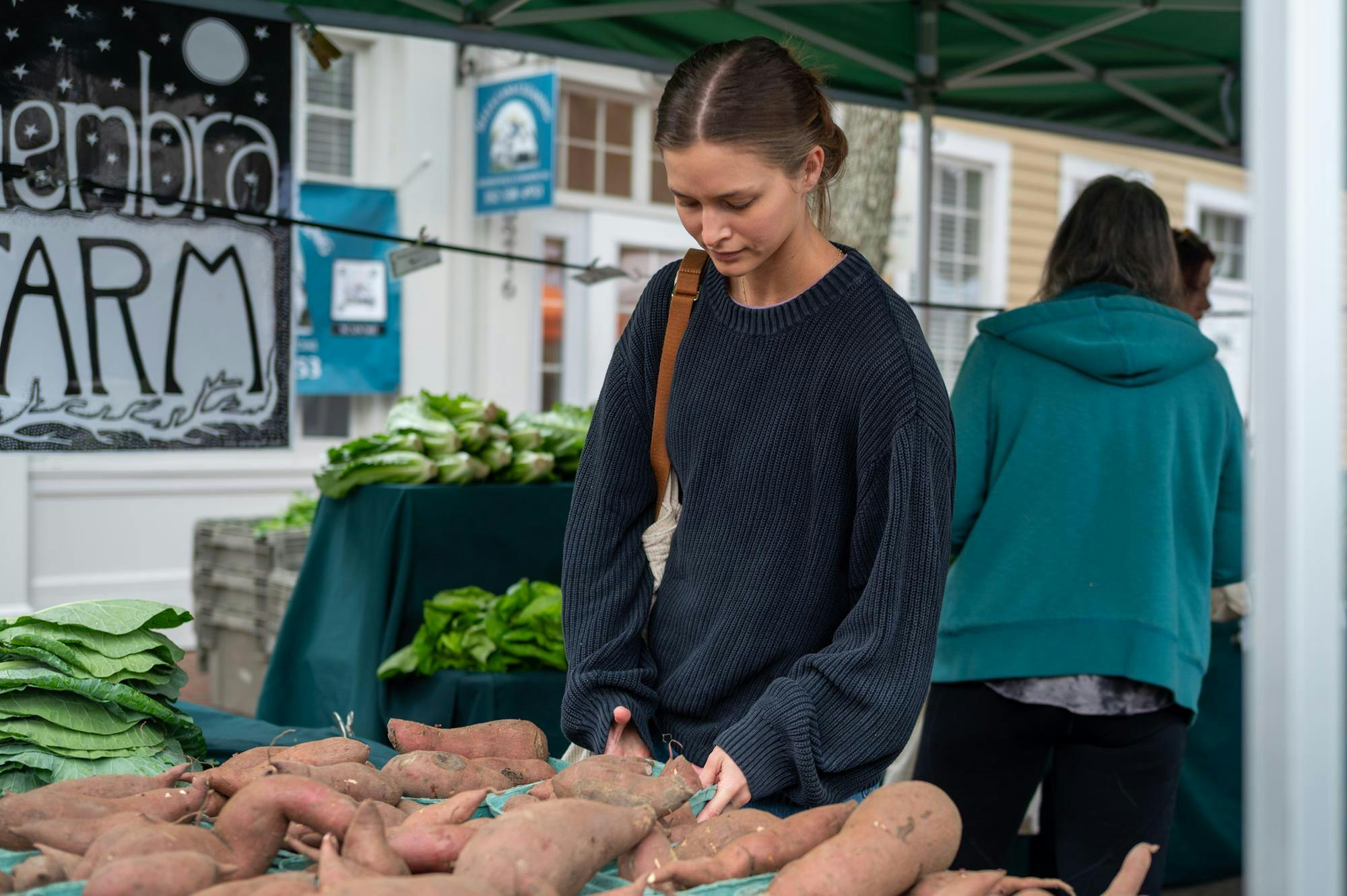 Shoppers pick out fresh vegetables at Haile Plantation Farmers Market in Gainesville, Fla., Saturday, Jan. 24, 2026.