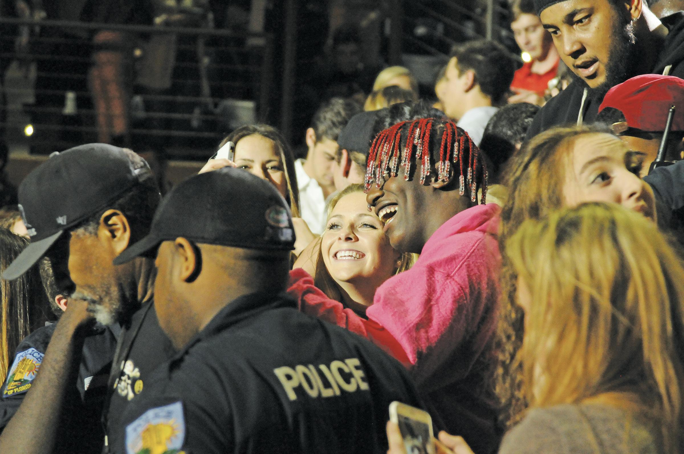 Rapper Lil Yachty takes a selfie with a girl in the crowd of about 6,000. He made an impromptu visit to the crowd during the performance on Wednesday, exciting fans before he was escorted backstage by security. 