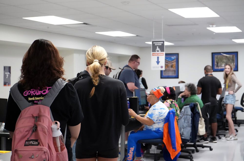 <p>UF students line up at the Reitz Union Printing Lab to cast their ballot for the Spring 2023 student body president, vice president and treasurer Tuesday, Feb. 28, 2023. </p>