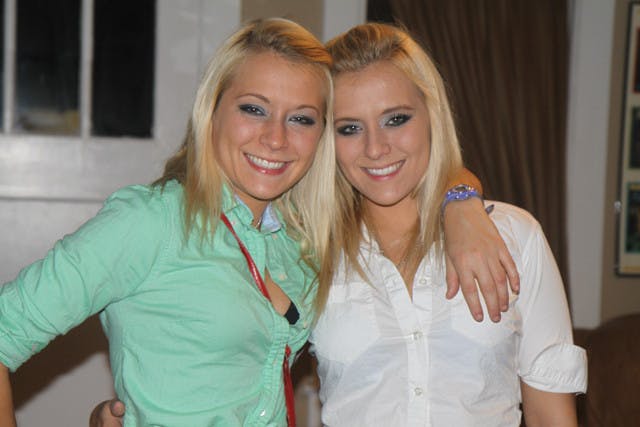 ‘Twinning' UF seniors Erica Taltos, left, and Brittany Taltos pose for a picture donning matching outfits before heading to midtown to celebrate Saturday night's football victory against FAU.