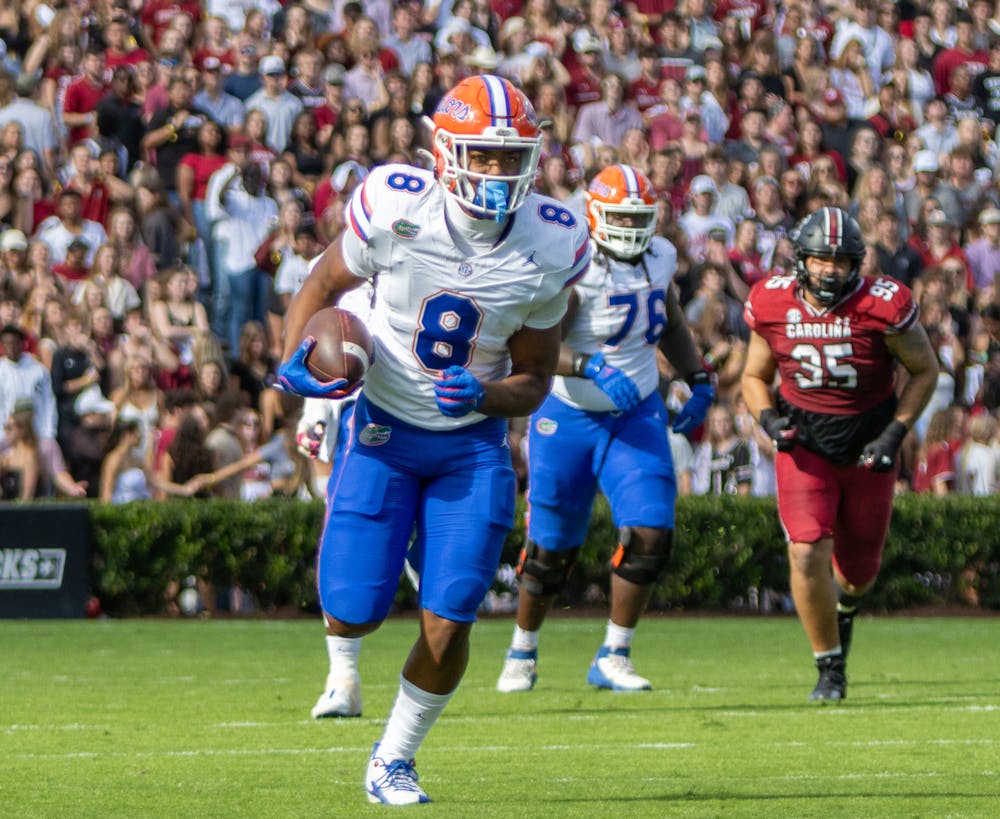 <p>Redshirt freshman tight end Arlis Boardingham runs with the ball in the Gators’ 41-39 win against the South Carolina Gamecocks in Columbia, SC on Saturday, Oct. 14, 2023.</p>