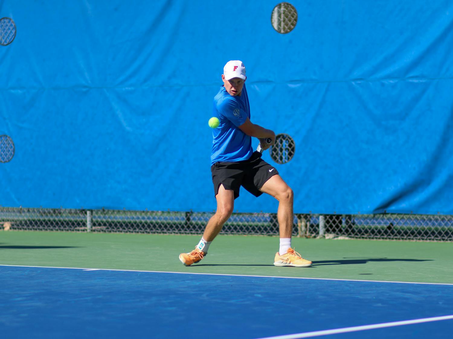 Florida senior Lukas Greif hits the ball in the Gators' 5-2 loss to the No. 8 Texas Longhorns Sunday, Jan. 15, 2023.