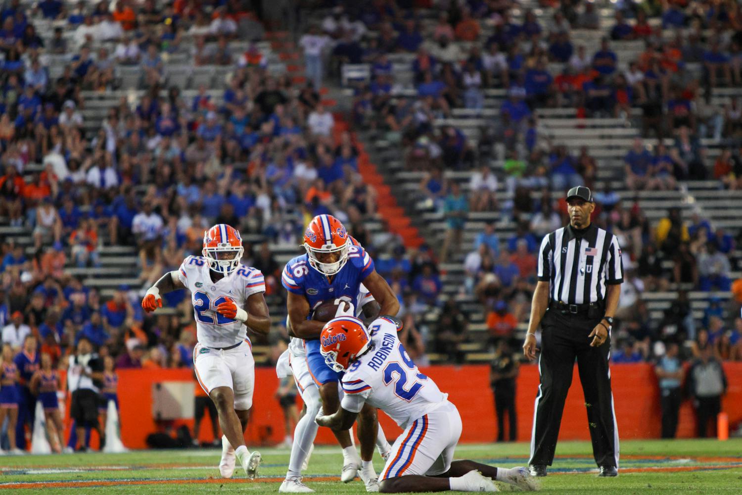 Florida linebacker Jaden Robinson tackles UF wide receiver Thai Chiaokhiao-Bowman in the Gators' Orange and Blue Game Thursday, April 13, 2023.