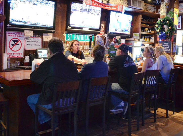 Patrons gather at Mother’s Pub and Grill on Tuesday evening. A recent UF study found that alcohol tolerance gets worse with age.