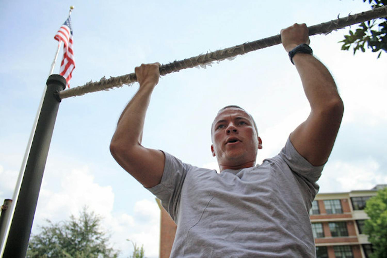 Air Force ROTC member Brandon Feldman does pull-ups before Physical Training. He is a member of the Air Force ROTC Detachment 150.