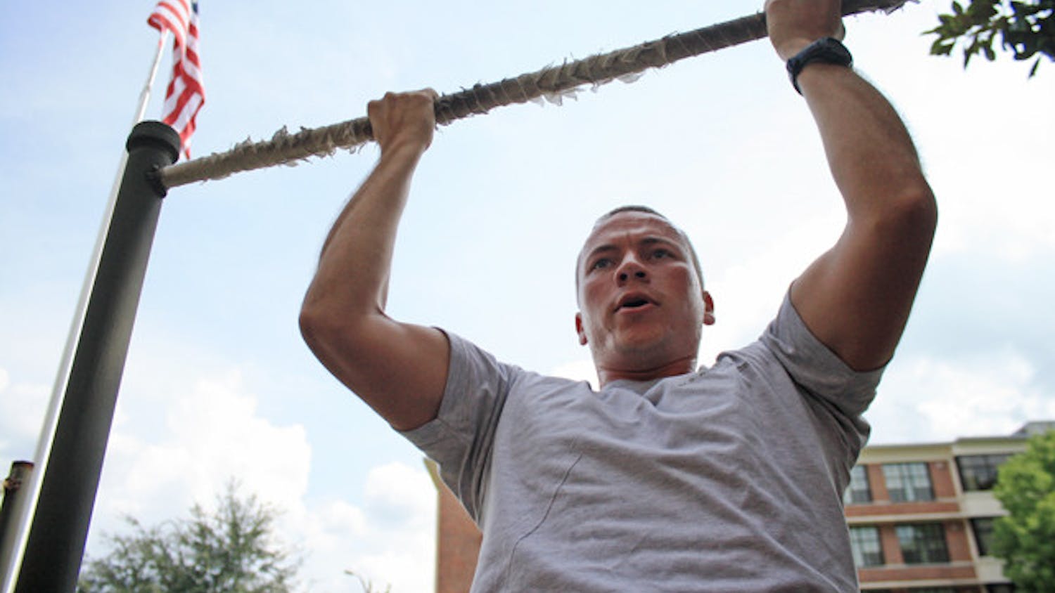 Air Force ROTC member Brandon Feldman does pull-ups before Physical Training. He is a member of the Air Force ROTC Detachment 150.