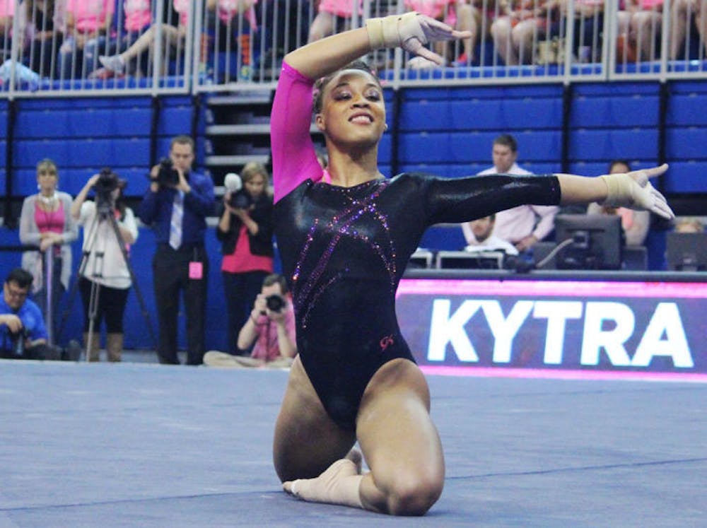 <p>Kytra Hunter performs a floor routine during Florida’s 198.125-197.625 win against LSU on Feb. 21 in the O’Connell Center. Hunter landed six perfect scores (four on floor and two on vault) during the 2014 season.</p>