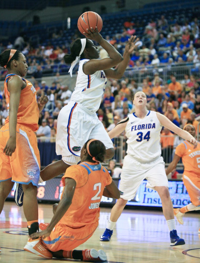 January Miller (right) attempts a shot during Florida’s 78-75 overtime loss to Tennessee on Sunday at home.
