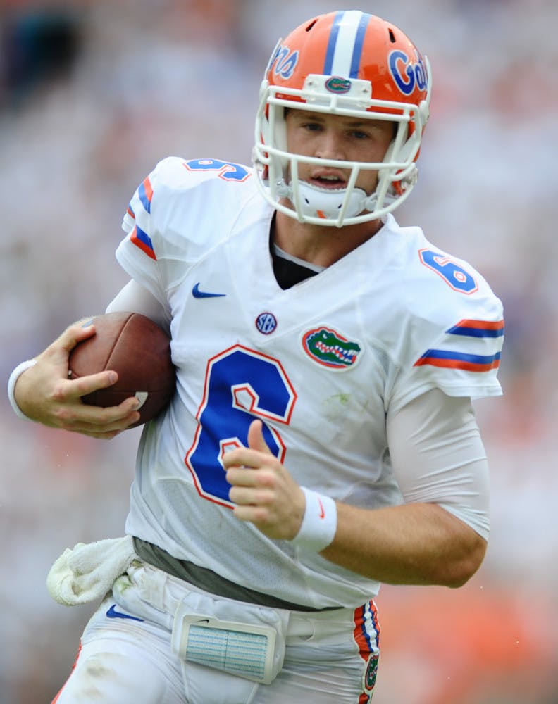 Jeff Driskel runs through a drill during warm-ups prior to Florida’s 21-16 loss to Miami on Saturday in Sun Life Stadium. Driskel turned the ball over three times in the game.
