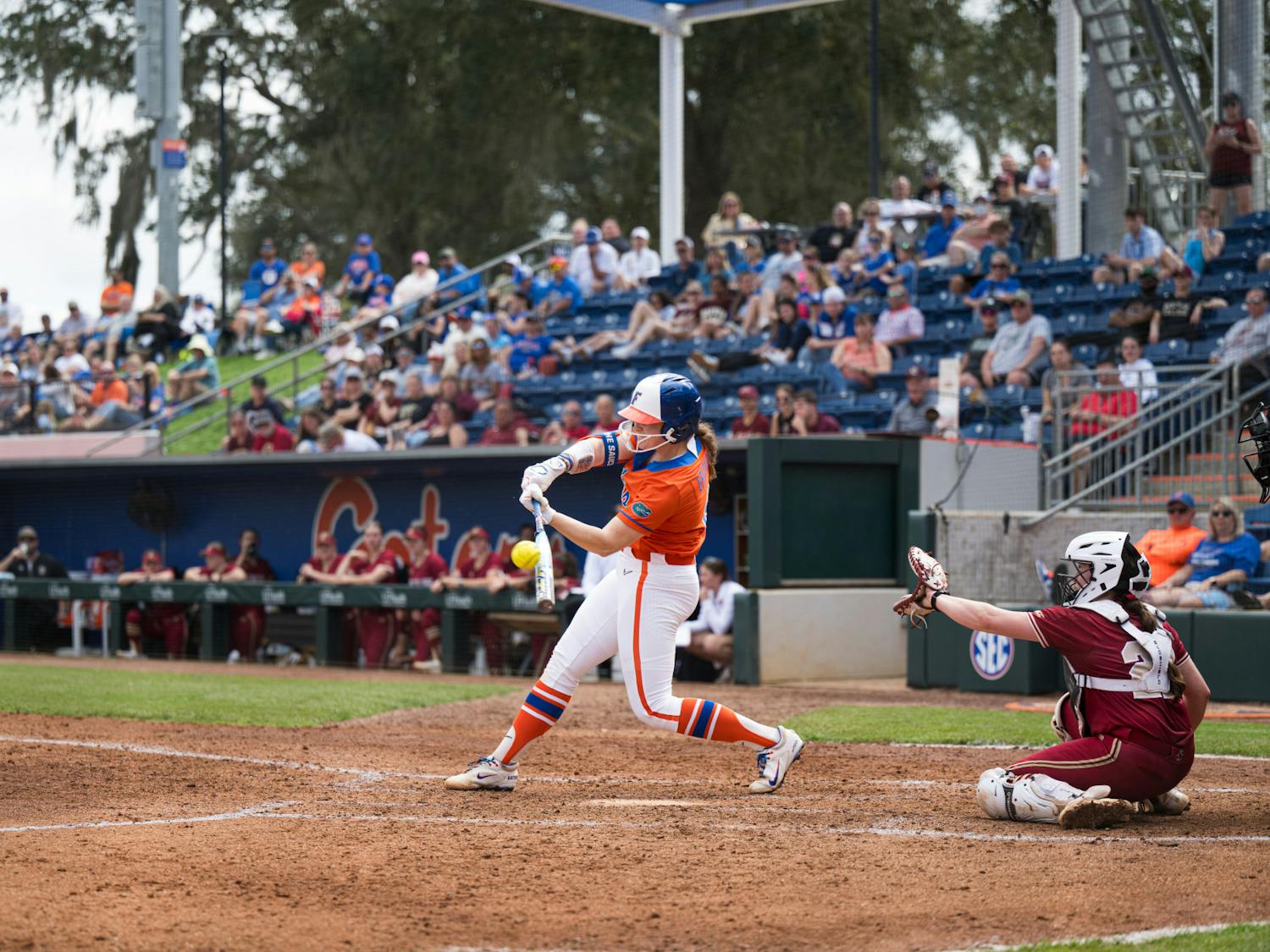 Florida Gators catcher Jocelyn Erickson (8) hits the ball in a softball game against Boston College in Gainesville, Fla., on Saturday, Feb. 15, 2025.