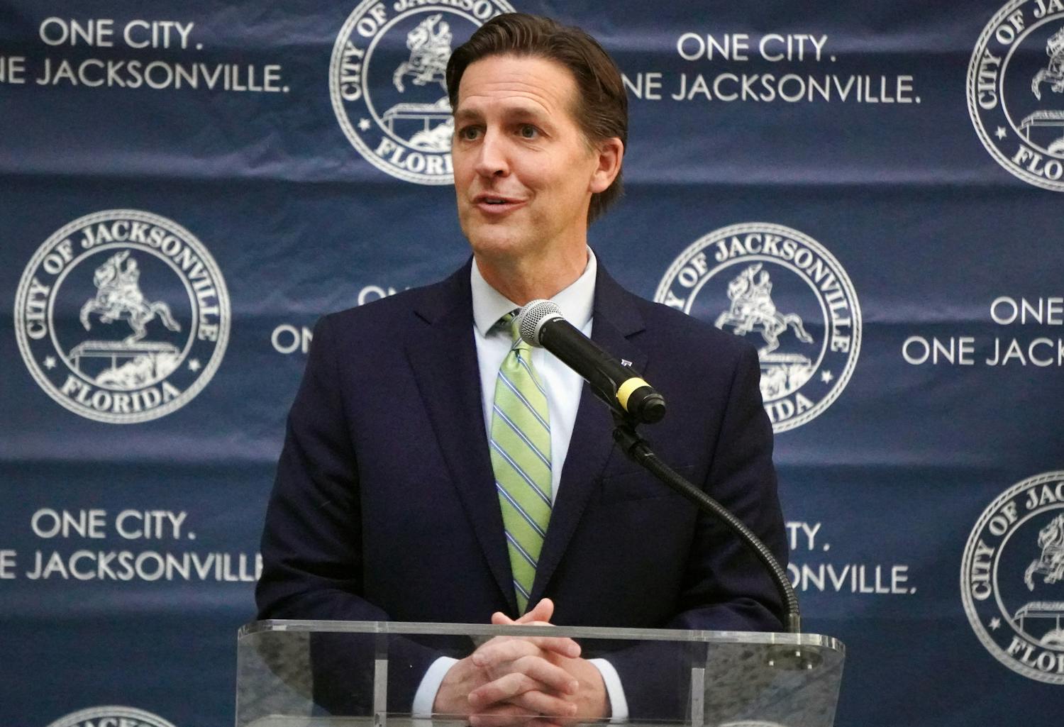 UF President Ben Sasse talks with attendees of the press conference held at Jacksonville City Hall about plans to open a new graduate campus, Tuesday, Feb. 7, 2023.