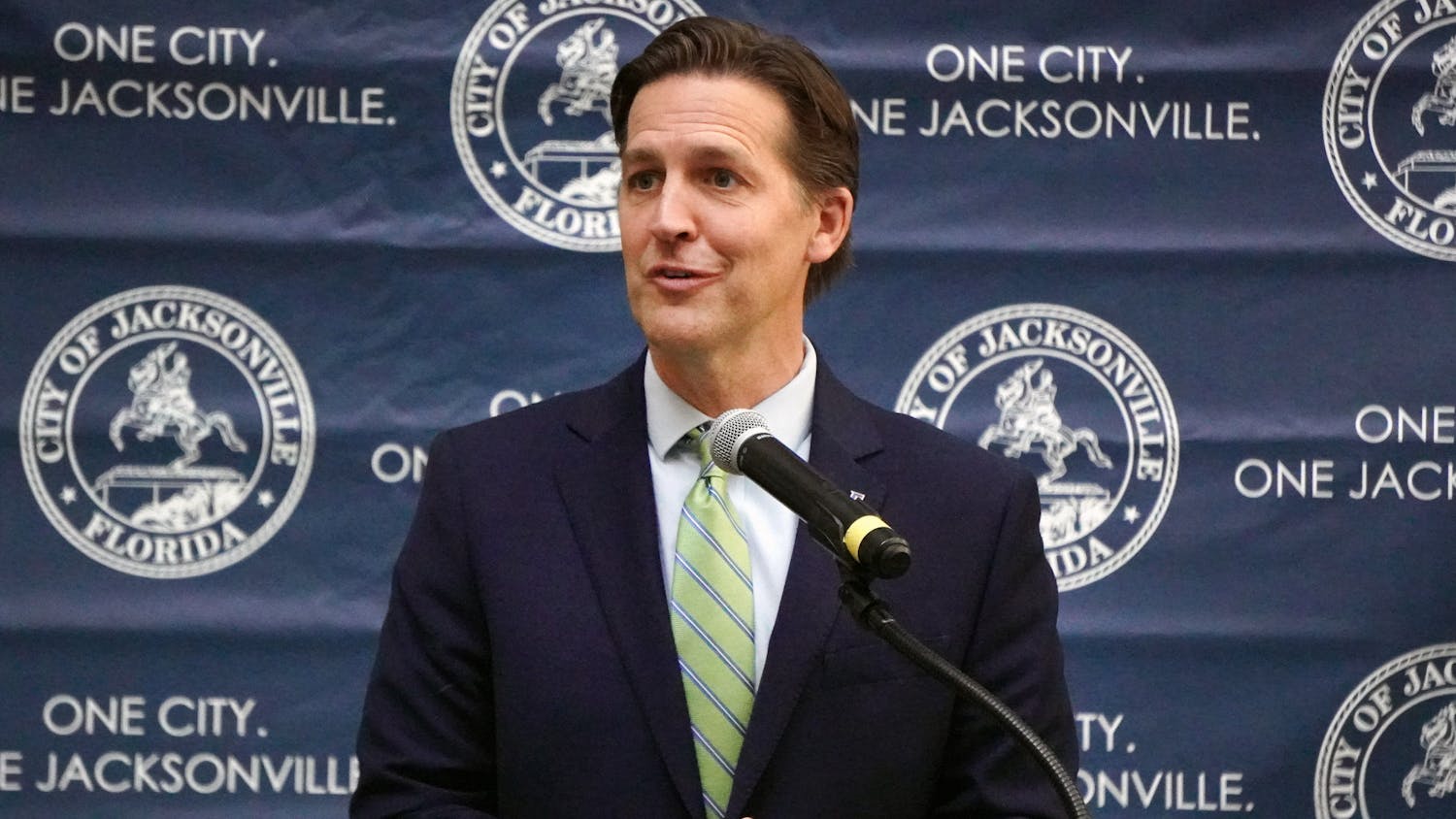 UF President Ben Sasse talks with attendees of the press conference held at Jacksonville City Hall about plans to open a new graduate campus, Tuesday, Feb. 7, 2023.