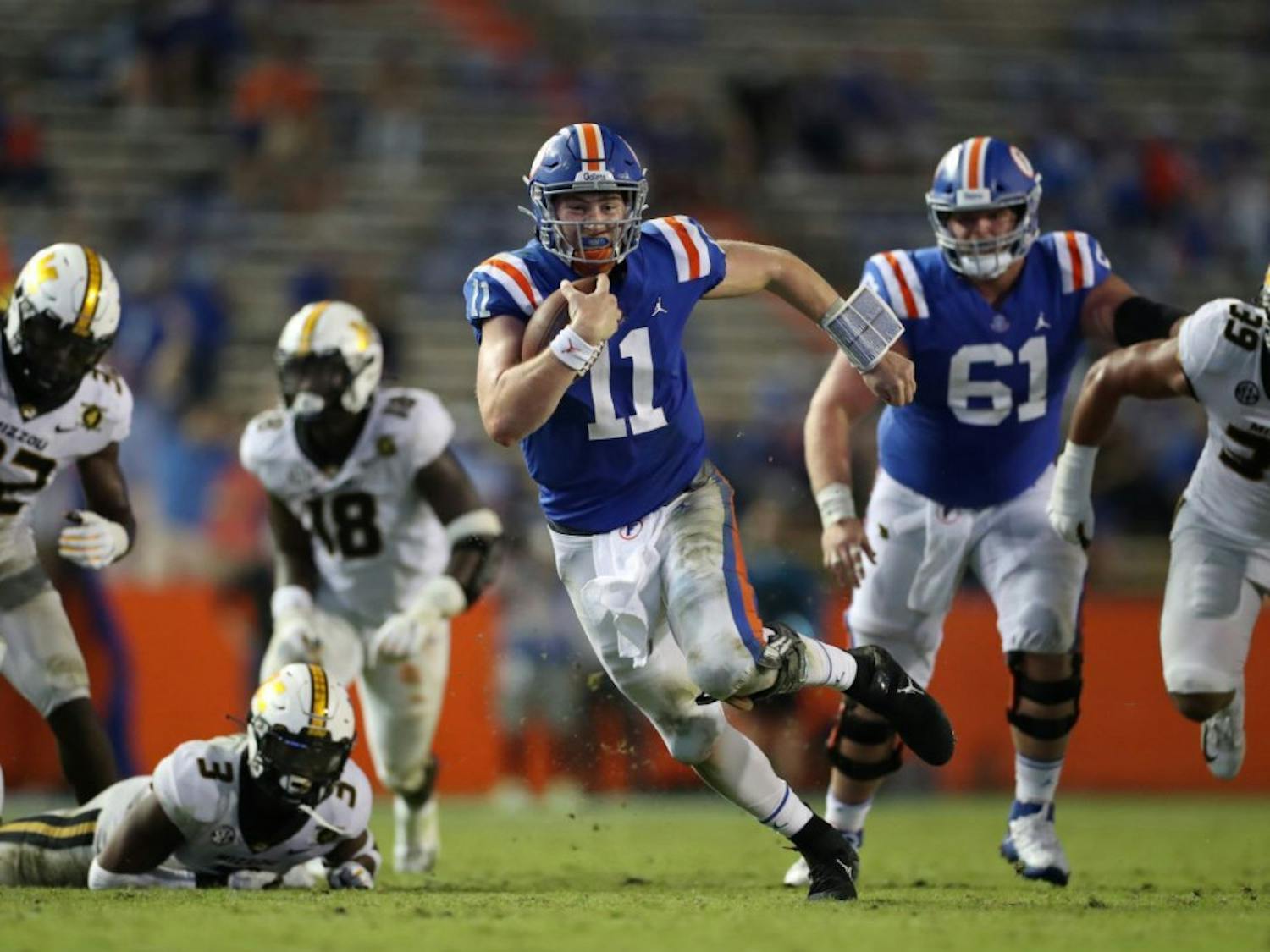 Kyle Trask darts through Missouri defenders in Florida's game versus Missouri on Oct. 31. He and senior Kadarius Toney will lead the Gators in their charge against Georgia this weekend.