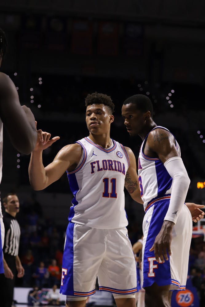 Junior Keyontae Johnson (left) and sophomore Scottie Lewis (right) at the Gators' game against Arkansas last season. They are among Florida's returning defensive leaders this season.