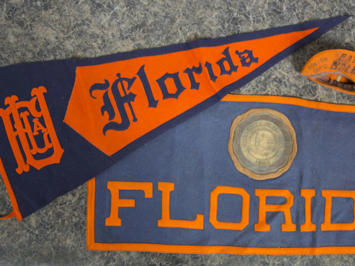 The University Archives at the George A. Smathers Libraries received a triangular pennant, a rectangular banner and a “rat cap” from the 1930s as a donation. They are among the oldest items in the university’s collection.&nbsp;