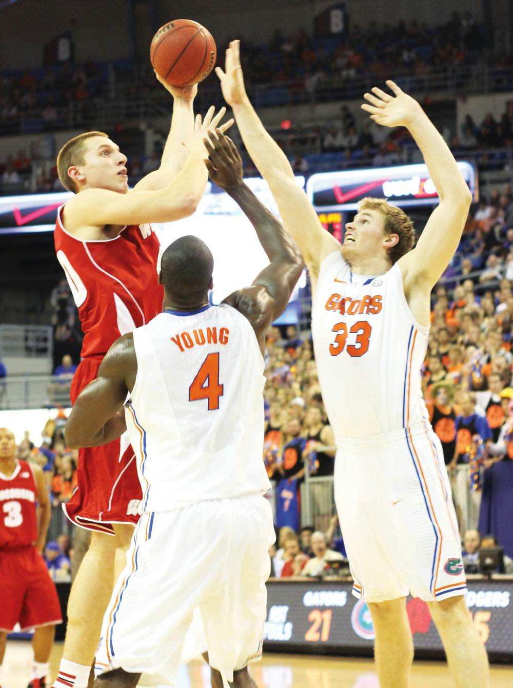 Erik Murphy (33) and Patric Young (4) try to block a shot from Jared Berggren during Florida's 74-56 win at home against Wisconsin on Nov. 14th. While the No. 13 Gators are 9-2, their defensive efficiency numbers have been down the last two games.
