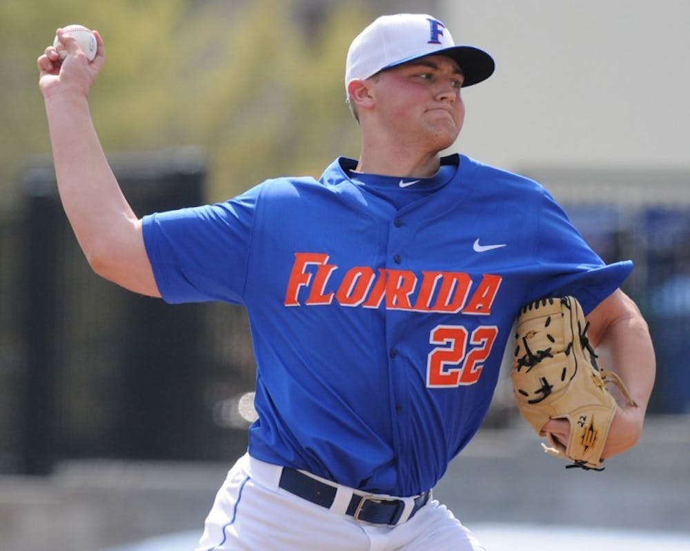<p>Karsten Whitson pitches during UF’s 5-0 win against USF on Feb. 20, 2011.&nbsp;</p>