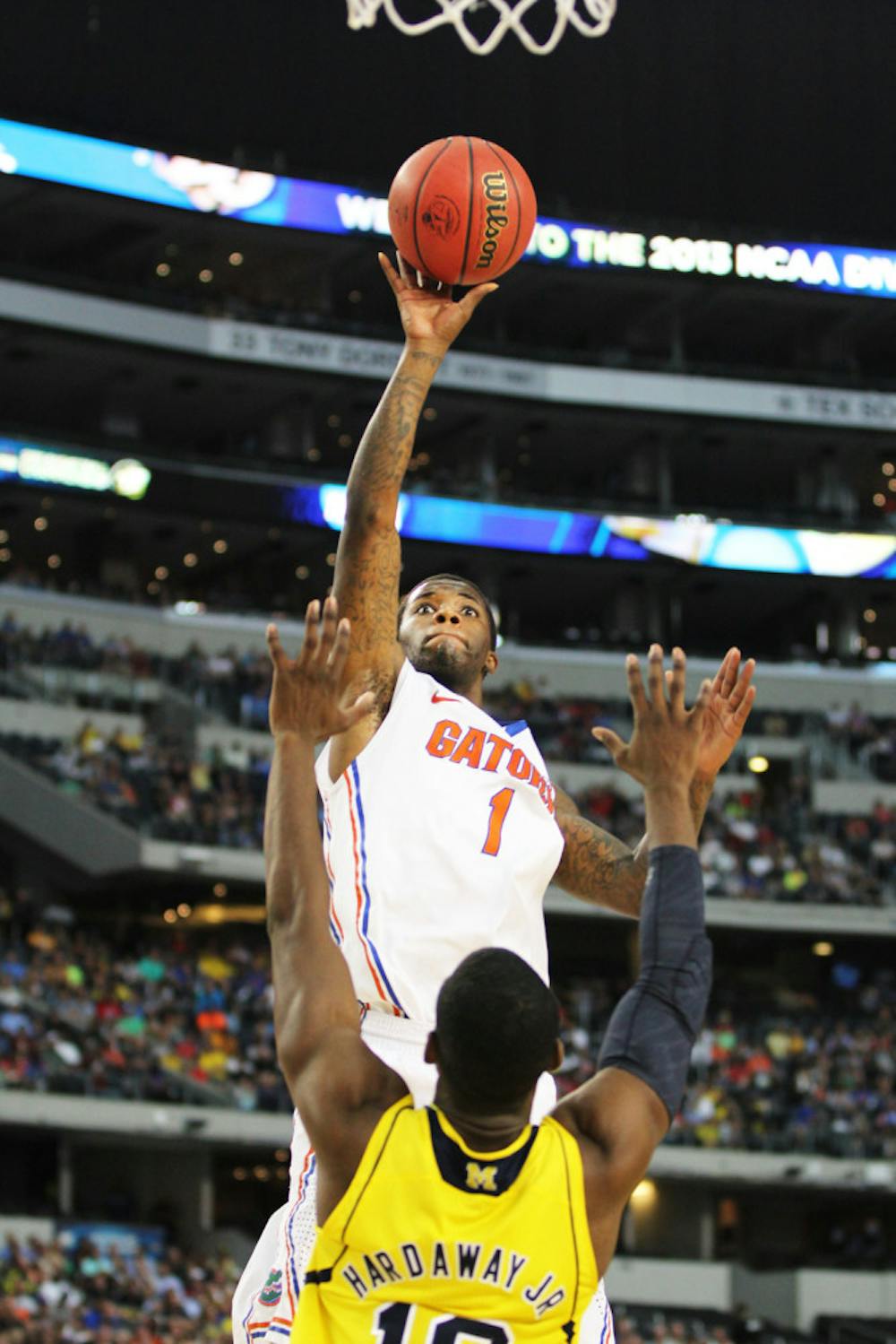 <p class="p1">Senior guard Kenny Boynton attempts a shot against Michigan guard Tim Hardaway Jr. during Florida’s 79-59 loss on Sunday in Cowboys Stadium. Boynton missed the cut for the Los Angeles Lakers' summer league roster, which was released Thursday. </p>