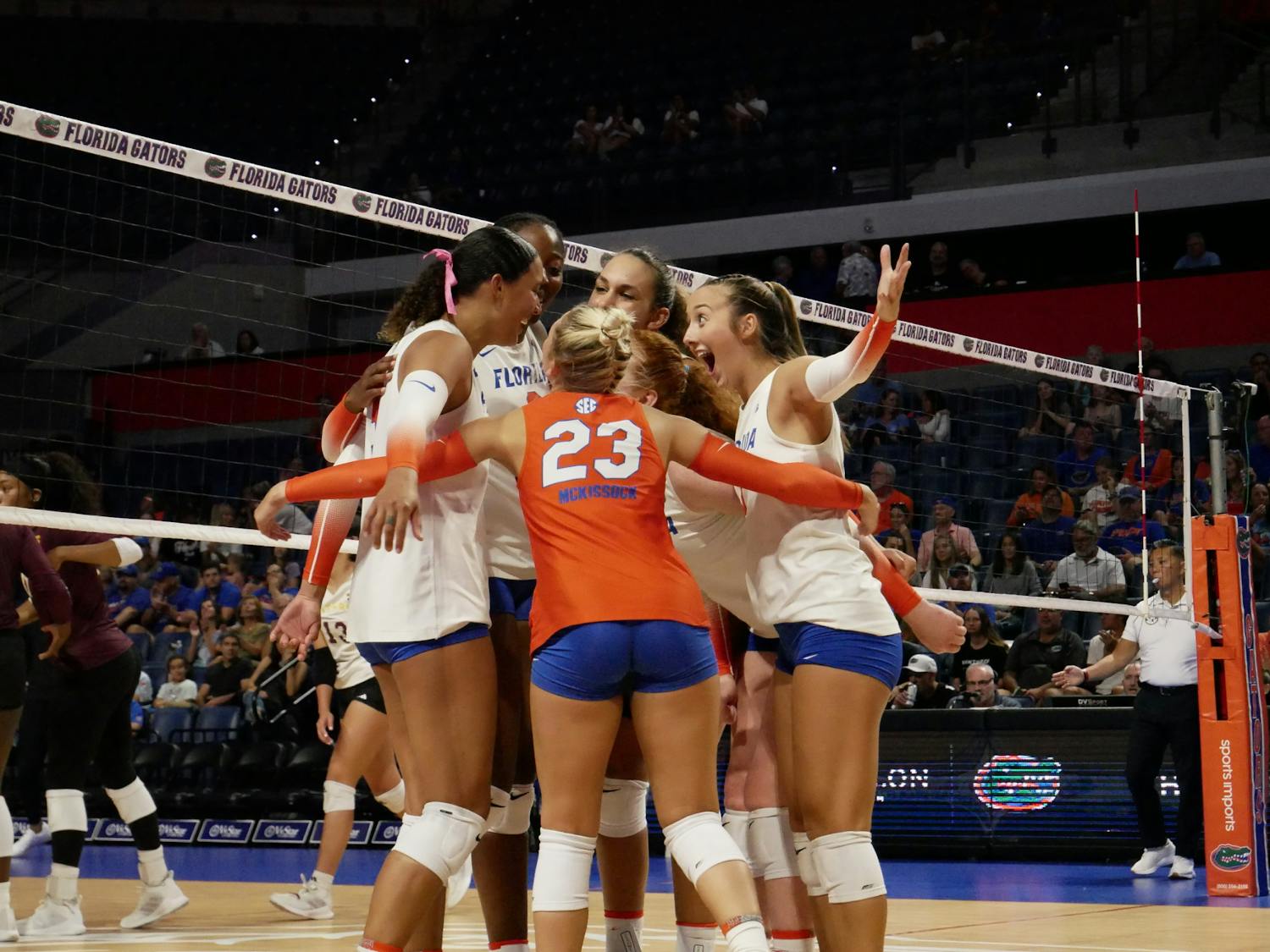 The Gators volleyball team celebrates in Florida's 3-0 win against the Winthrop Eagles Saturday, Sept. 9, 2023. 