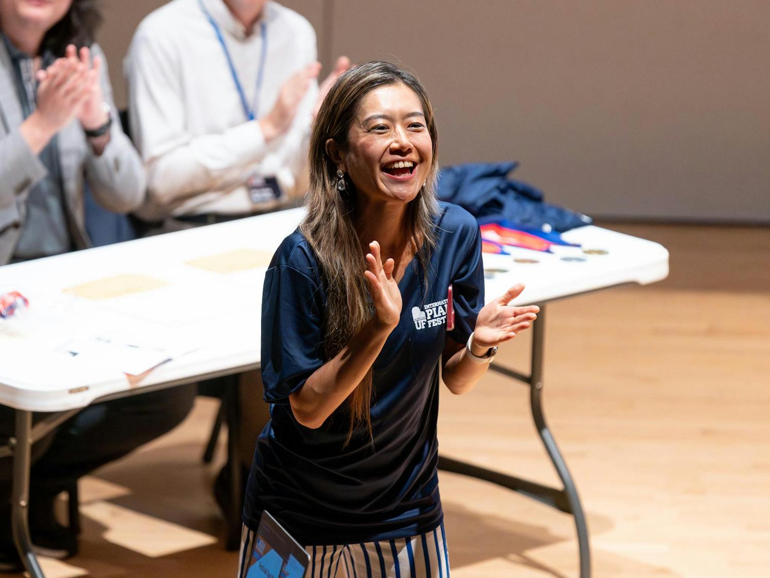 An announcer celebrates during the award ceremony of the UF International Piano Festival on Saturday, June 15, 2024.