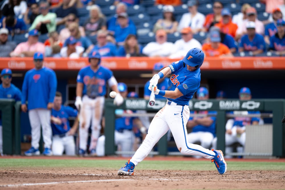 Florida Gators outfielder Hayden Yost (16) hits the ball in a baseball game against the Air Force Academy in Gainesville, Fla., on Friday, Feb. 15, 2025.