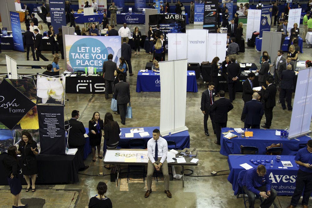 Students meet with employers from companies like Aramark, Target, P&amp;G, Nationwide Insurance and Verizon during the first non-technical day of Spring Career Showcase on Jan. 26, 2016. Two floors of the Stephen C. O'Connell Center held hundreds of tables for UF students and alumni.