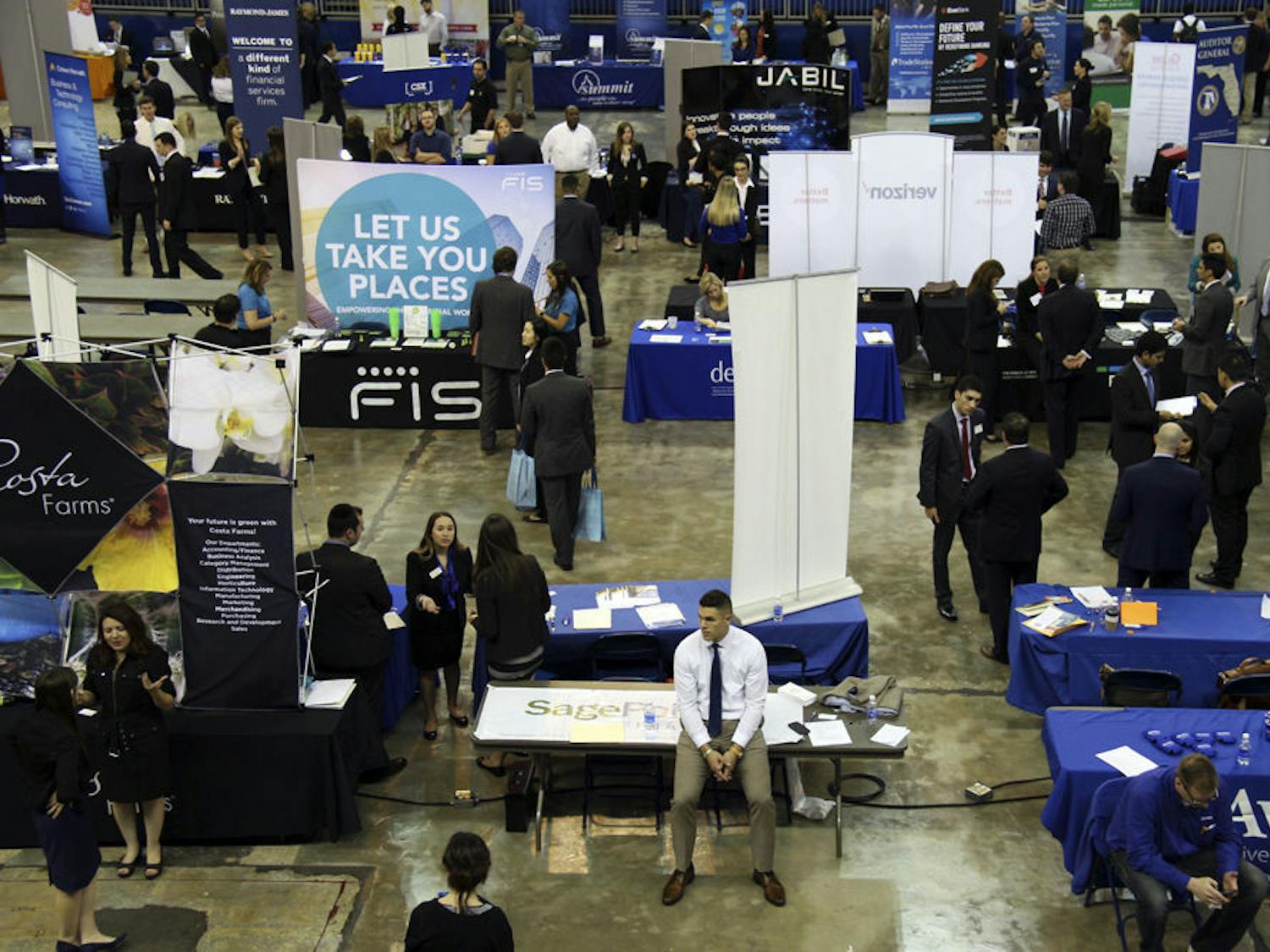 Students meet with employers from companies like Aramark, Target, P&G, Nationwide Insurance and Verizon during the first non-technical day of Spring Career Showcase on Jan. 26, 2016. Two floors of the Stephen C. O'Connell Center held hundreds of tables for UF students and alumni.