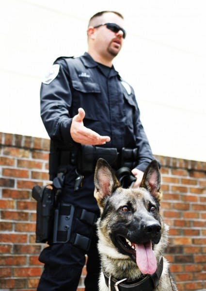 K-9 Roo and handler, Officer Jeff Kerkau outside Gainesville Police Department Administration building