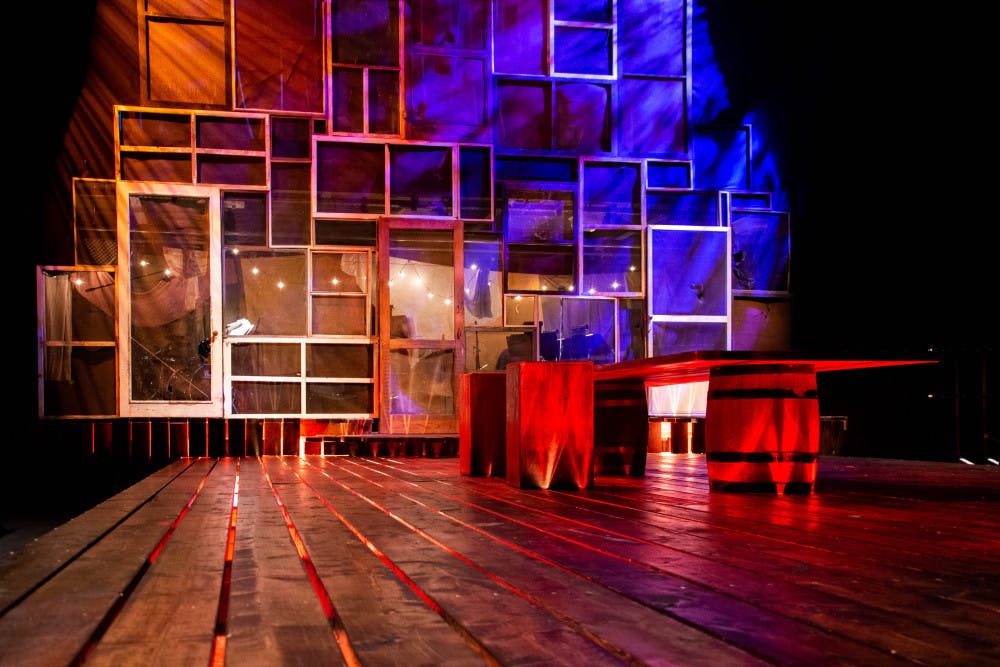 <p>The set with lighting for “Hills on Fire” in the Black Box Theatre. The lighting design for the show is by Jordan Lindquist, a UF lighting design junior.  </p>