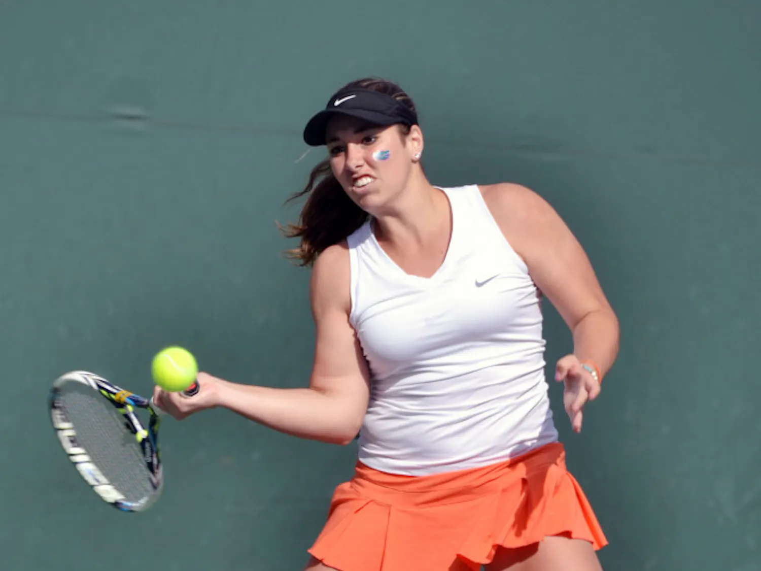 Brooke Austin hits an open-stance backhand during Florida women's tennis' 4-0 win against Elon on Jan. 24, 2015, at the Ring Tennis Complex.