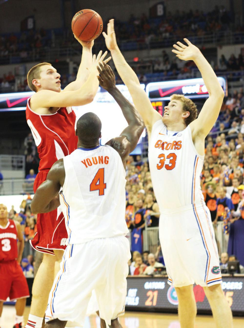 <p><span>Erik Murphy (33) and Patric Young (4) try to block a shot from Jared Berggren during Florida's 74-56 win at home against Wisconsin on Nov. 14th. While the No. 13 Gators are 9-2, their defensive efficiency numbers have been down the last two games.</span></p>
<div><span><br /></span></div>