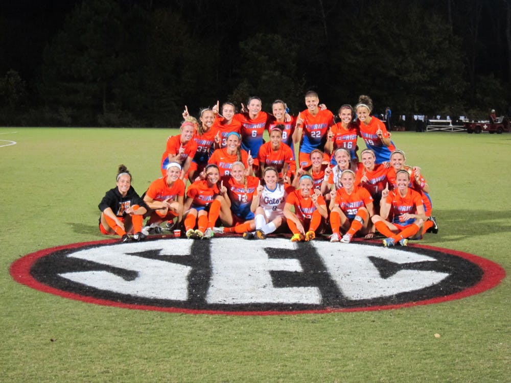 <p>The Florida soccer team celebrates after winning a share of the Southeastern Conference with its 5-1 win against Georgia on Thursday night in Athens, Ga.</p>