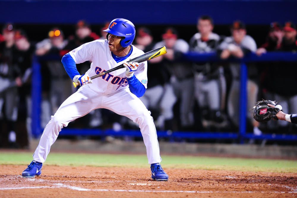 <p>Buddy Reed looks to bunt during Florida's 4-0 win over Maryland.</p>