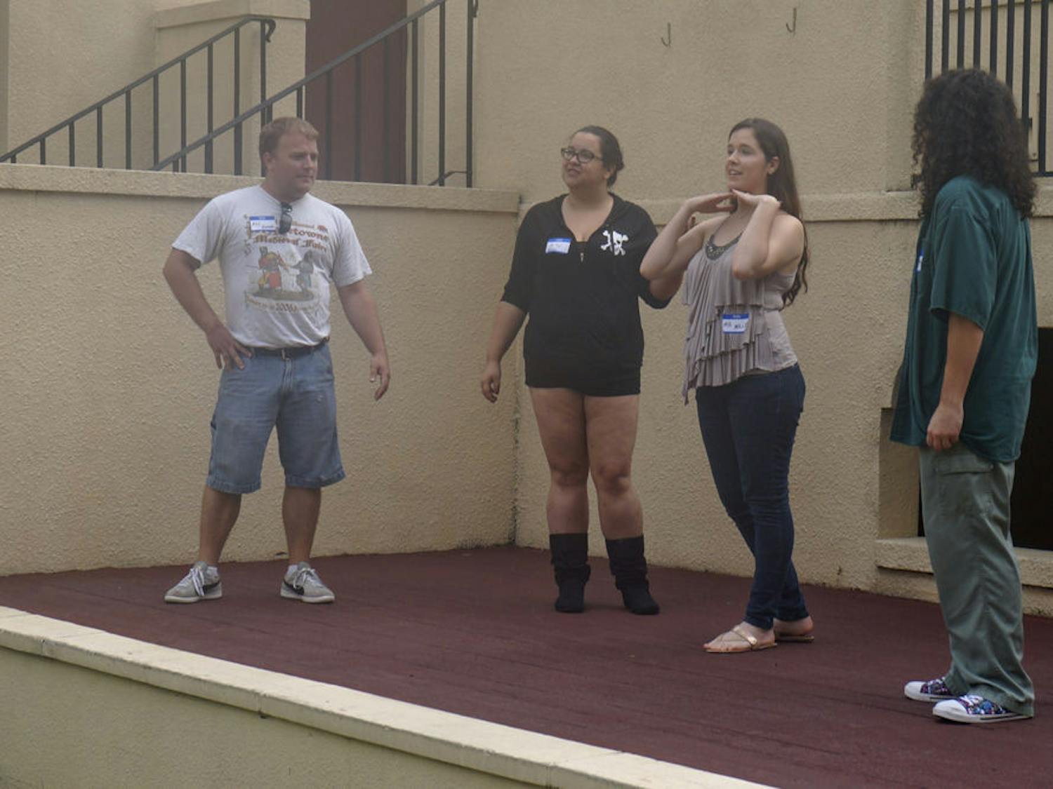 Guild members (from left) Scott West, Kayte Sands, Mollie Lassiter and Miranda Lipsig perform a skit during Thieves Guild auditions at the Thomas Center Galleries on Aug. 29, 2015.